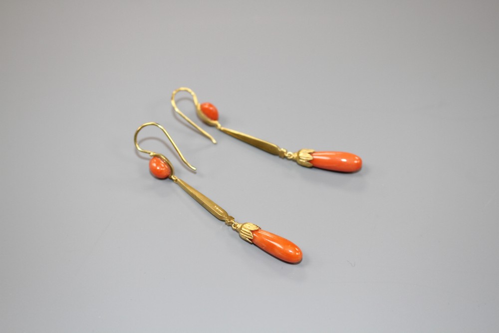 A pair of early-mid 20th century yellow metal (one stamped 15ct) and coral set drop earrings, overall 62mm, gros weight 6 grams.